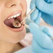 Woman with her mouth open having dental work done